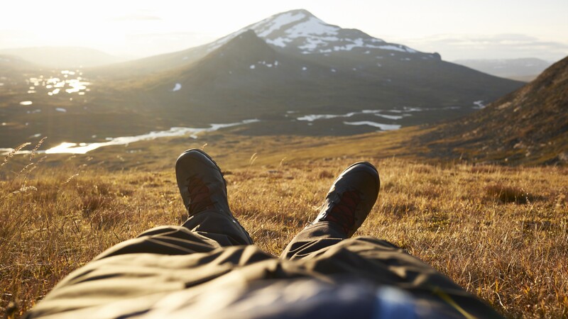 A person is resting on the mountain.