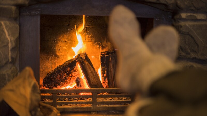 Feet in front of a fire